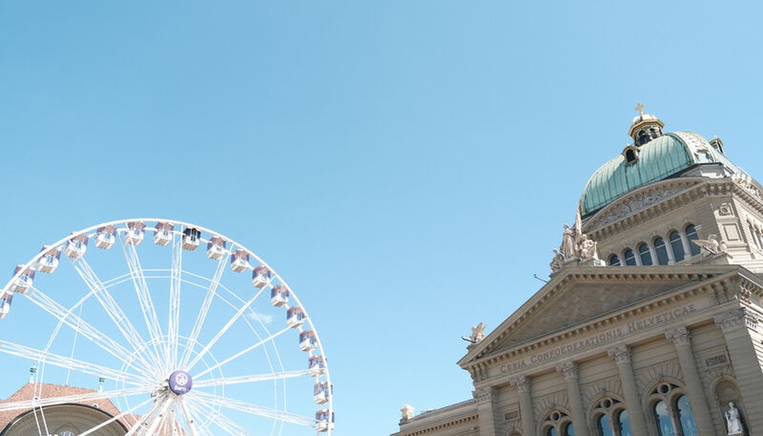 Riesenrad an der WEURO2025 mit Bundeshaus im Hintergrund